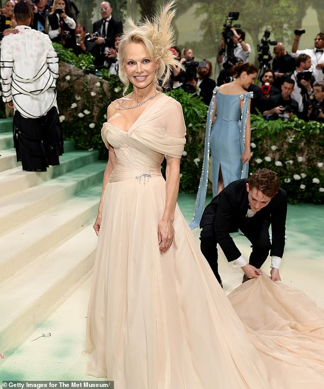 The Playboy model attended the 2024 Met Gala this month. She stunned in a busty champagne-colored dress.