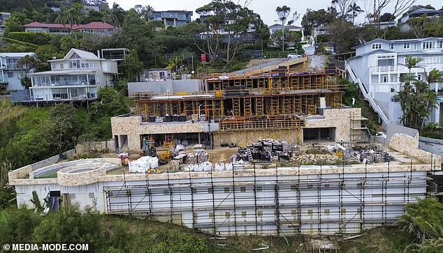 Elsewhere, piles of construction materials could be seen waiting, protected from the weather and salty ocean breezes by huge black tarps.