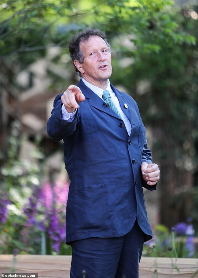 Horticulturist Monty Don (pictured) looked dapper in a navy suit, which he teamed with a light blue shirt and turquoise print tie.