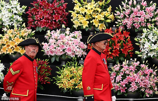 Chelsea pensioners view flower displays at the Chelsea Flower Show, in London, on opening day.