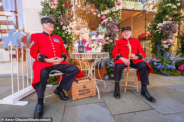 Chelsea pensioners sitting outside the LK Bennet store on King's Road to mark the first day of the Chelsea Flower Show