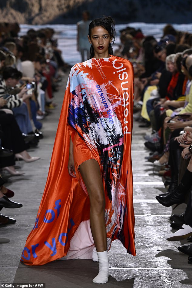 Pictured: A model walking the runway during Australian Fashion Week 2024.