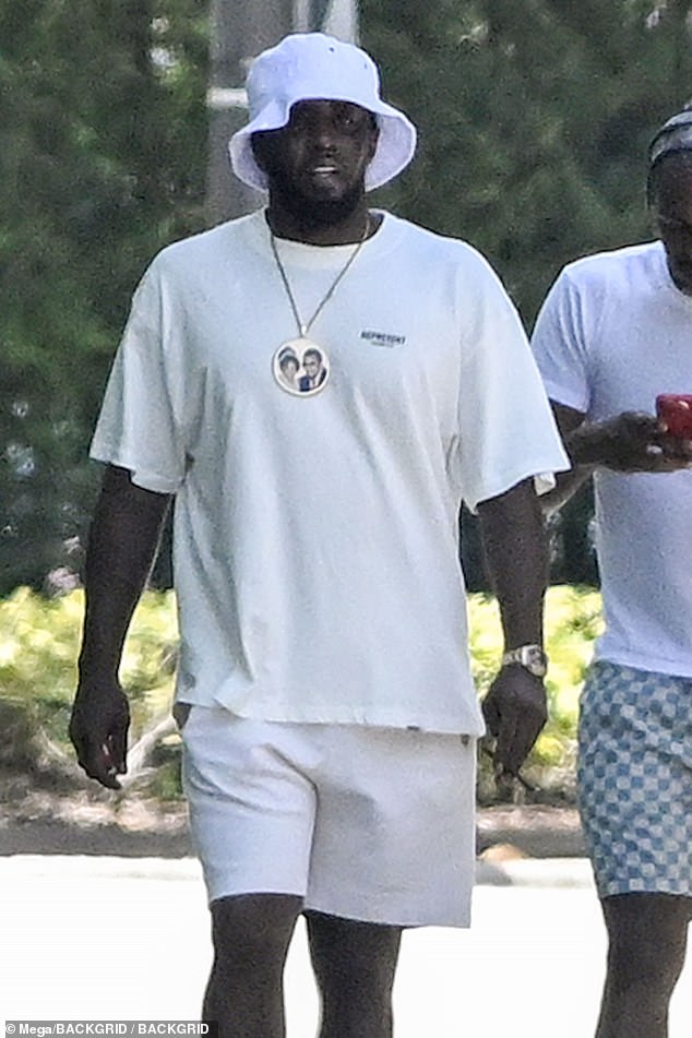 The billionaire rapper was photographed taking a walk with friends outside his Miami home on Sunday, hours after posting his apology video.