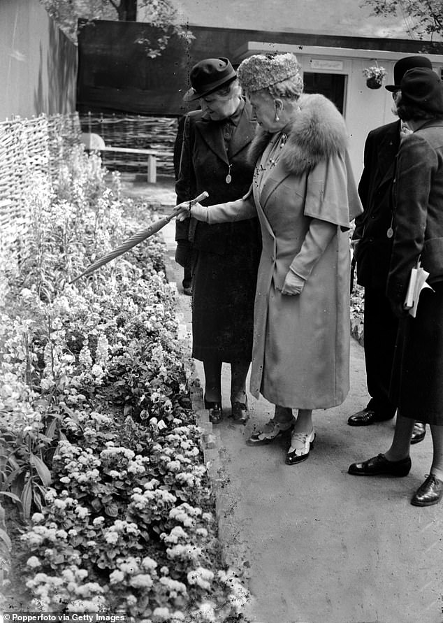 Queen Mary points out an exhibition at the Chelsea Flower Show in 1950