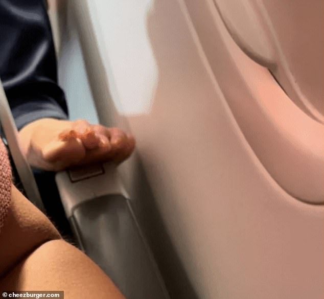 Not toe! A mother traveling with her young daughter was horrified to see a man barefoot on her armrest during a flight.