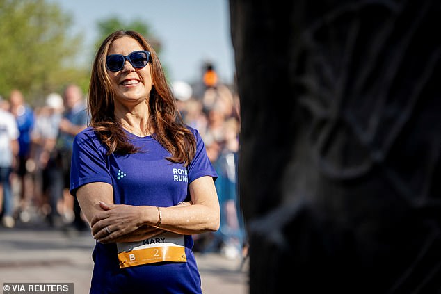 Mary smiled behind her sunglasses as she prepared to participate, wearing a bib with the number 2 that had her name on it.