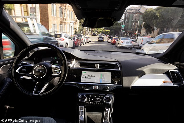 A Waymo autonomous vehicle traveling on Oak Street in San Francisco on November 17, 2023.