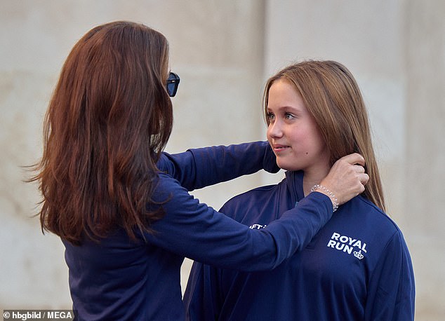 The Queen affectionately brushed her daughter's hair away from her face at the beginning of the event