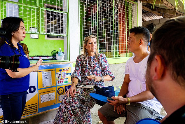 She appeared engaged as she spoke to several locals and posed for photographs.