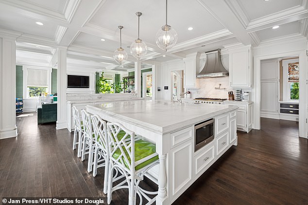 Inside the 12,492-square-foot home is a massive kitchen with a center island.