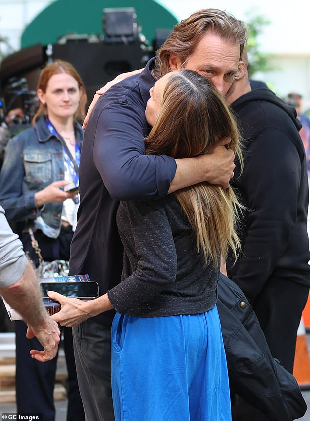 At one point, he gave a warm hug to Parker, who was clutching his book, The Demon of Unrest: A Saga of Hubris, Heartbreak, and Heroism at the Dawn of the Civil War.