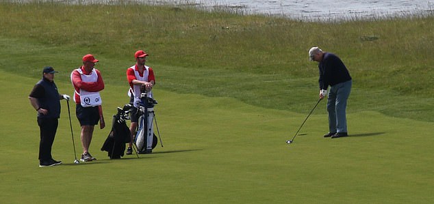 Prince Andrew was pictured today lining up a shot at Castle Stuart while playing golf with a few others.