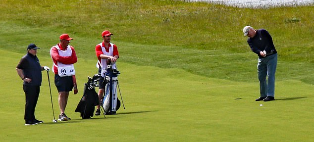 Andrew was joined by three other players on the course's picturesque grounds, while four men, dressed in red with white overalls and red caps, caddied for the quartet.