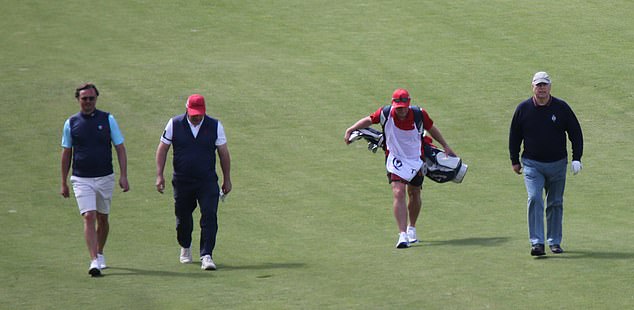 Prince Andrew pictured today strolling across the immaculately manicured lawns of Stuart Castle