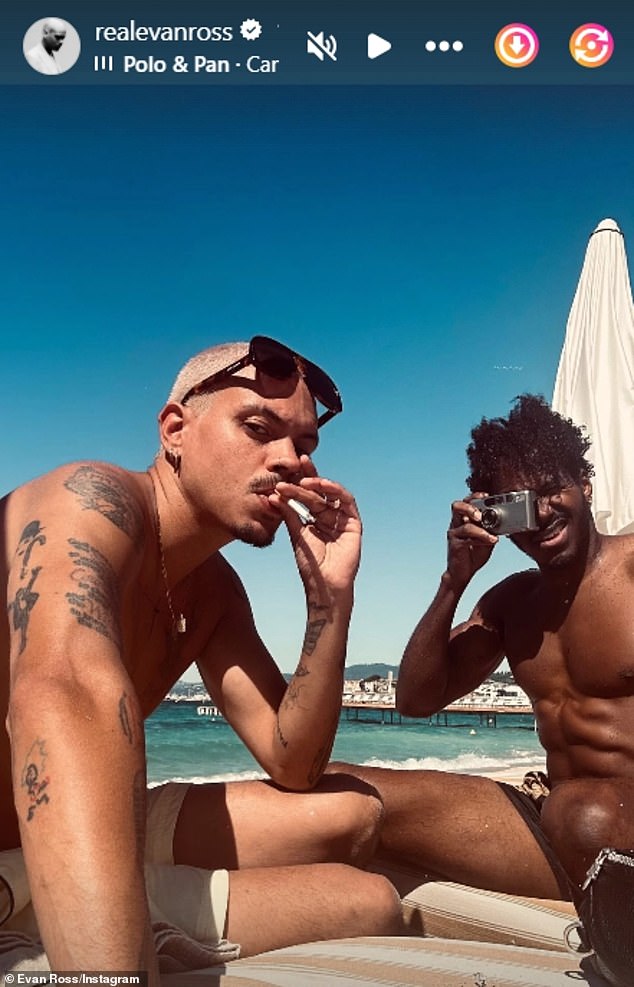 On Tuesday, YSL-obsessed Evan posted a shirtless photo of himself smoking a cigarette alongside a camera-flashing friend while visiting the south of France during the Cannes Film Festival.