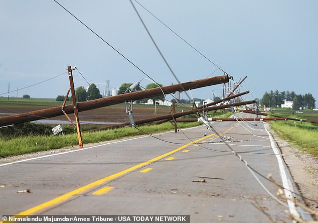 Power lines fell across the state (pictured in Nevada, Iowa), leaving tens of thousands without power.