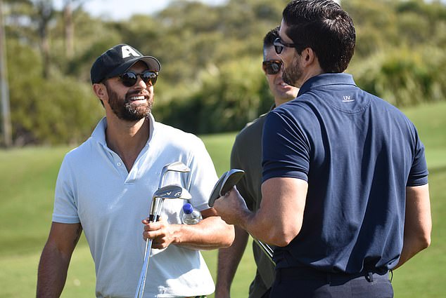 Duncan was surrounded by his MAFS mates, all laughing as they showed off the strong bond they have formed since their time on the show (pictured with Cameron Merchant).