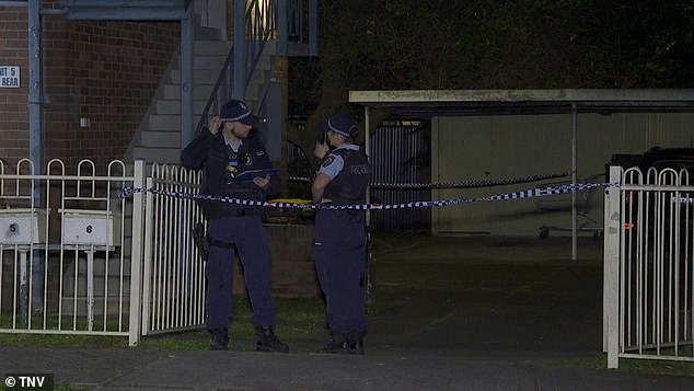 Police set up a crime scene and officers are investigating the incident (pictured, police outside the apartment complex in Auburn)