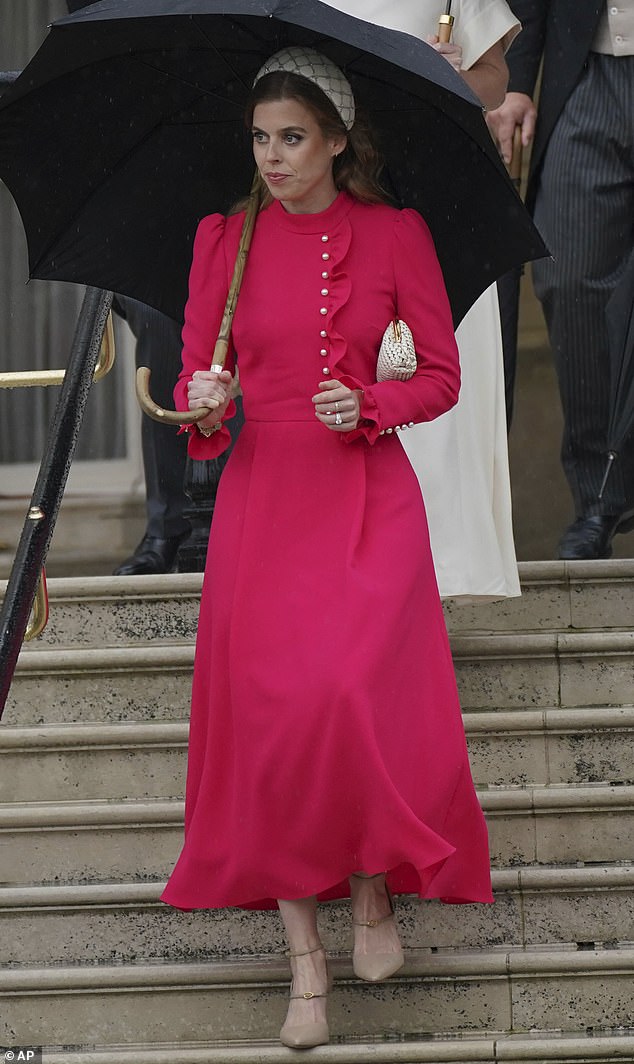 Looking equally radiant, Beatrice, 35, wowed in a £662.50 Beulah London Christina dress in crimson, teamed with a £645 white gem-embellished Emily-London headband.