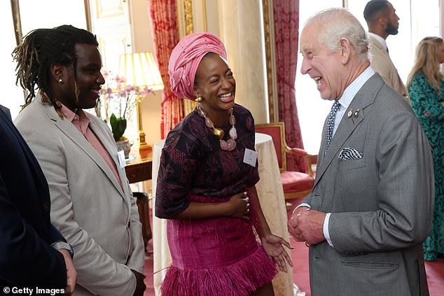 DJ Cuppy (C) and King Charles III (R) during a reception for the winners of the 20th Prince's Trust Awards.