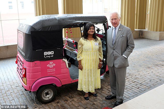 Charles with Arti, the winner of the Amal Clooney Award for Women's Empowerment