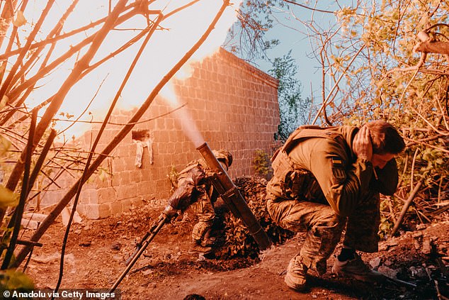 A 120mm mortar crew fires shells at Russian positions as the war between Russia and Ukraine continues in Chasiv Yar, Ukraine, April 27, 2024.