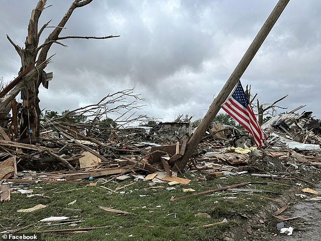 One image captured a tilted American flag, hanging from a wooden pole, as piles and piles of debris surrounded it.