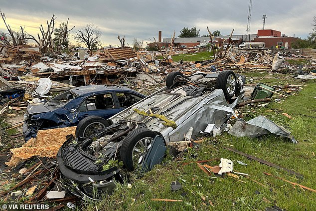 Damaged houses and cars are seen outside the Adair County Health System hospital in Greenfield