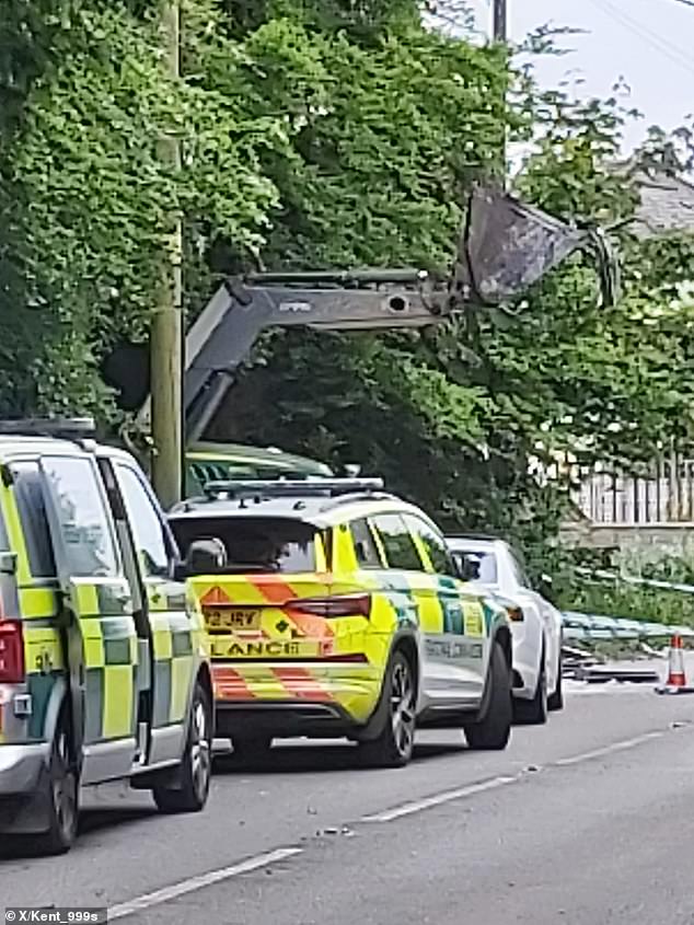 A tractor with its blade raised was seen near the accident site, which is believed to have been involved in the collision.