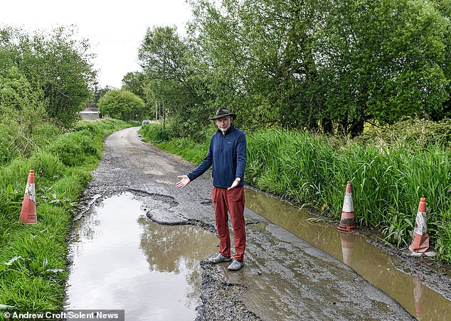 Residents of Charlton-All-Saints, in Wilshire, have been left with a 41ft long and seven foot wide crater that makes it almost impossible to get to their homes after a wet winter.