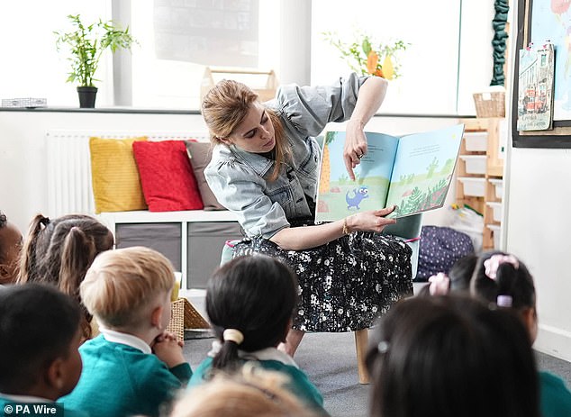 The royal read to children at reception and in Year One during a surprise trip to West Thornton Primary School in Croydon.