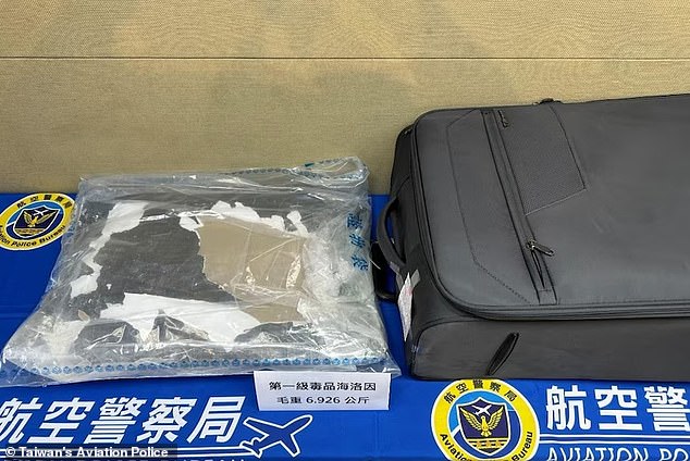 Authorities allegedly discovered 7kg of cocaine and heroin inside his luggage (pictured)