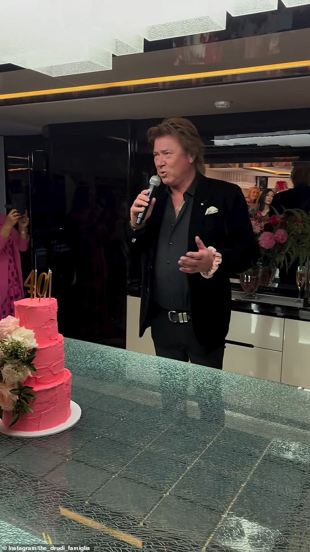 A guest uploaded footage of celebrity reporter Richard Wilkinson (pictured) toasting before Annika cut her three-tier pink birthday cake.