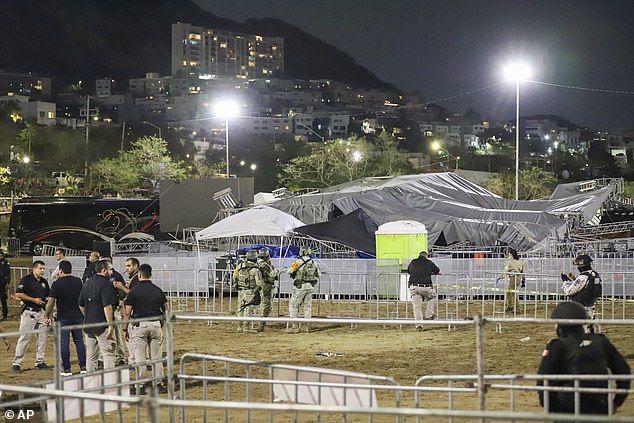 Security forces surround a stage that collapsed due to a gust of wind during a political rally in northern Mexico on Wednesday night.