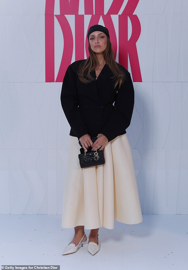 Model Carla Ginola looked elegant in a black jacket and an elegant long white skirt.