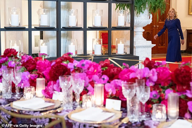 Around 1,000 candles will line the walls: American roses along with fuchsia and purple African orchids will constitute the centerpieces.