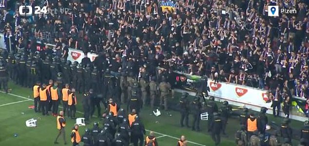 Riot police lined the stands to protect fans and prevent more from flooding the field.