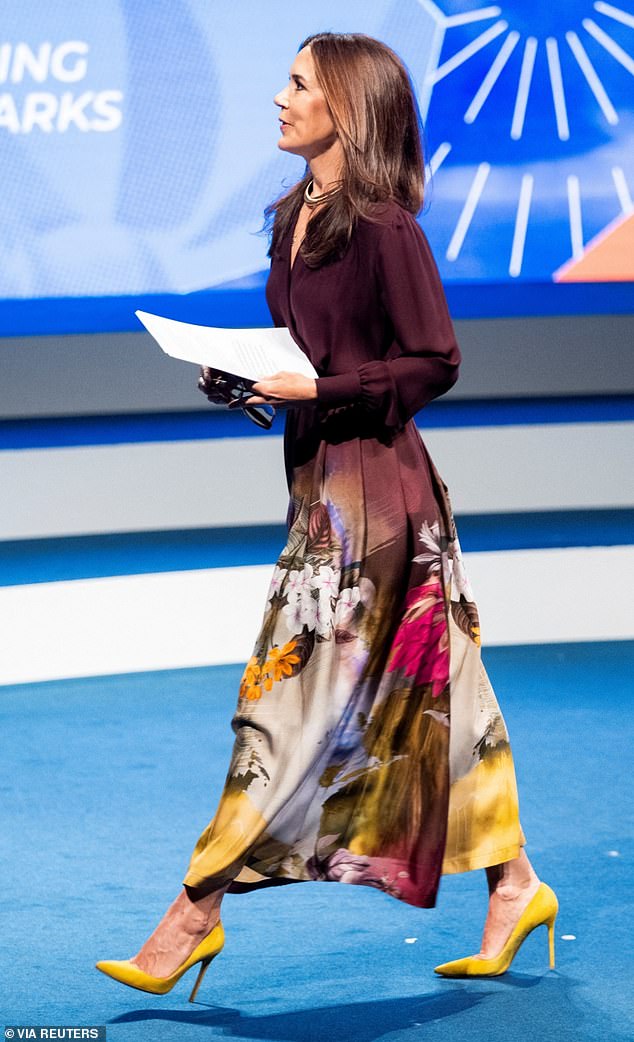 Holding her glasses and notes, Mary looked confident as she approached the podium.