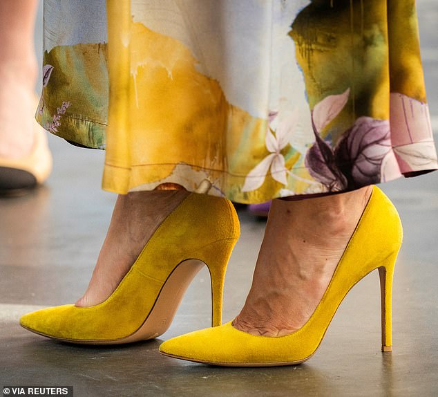 The royal added an extra pop of color to her elegant outfit with a pair of bright yellow suede heels.