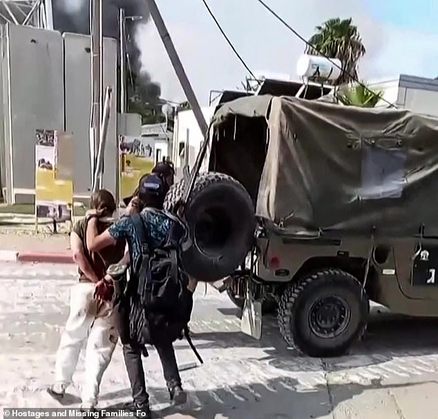 This video, taken from footage released by the Israeli Missing Families and Hostages Forum campaign group on May 22, 2024, shows what the group described as a female Israeli soldier being carried away by Palestinian Hamas militants during the May 7 attack. October 2023 against Israel.