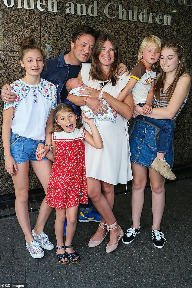 The chef, who has written 35 cookbooks, has five children: Poppy Honey, 20, Daisy Boo, 19, Petal Blossom, 13, Buddy Bear, 11, and River Rocket, five. In the photo with his children and his wife Jools.