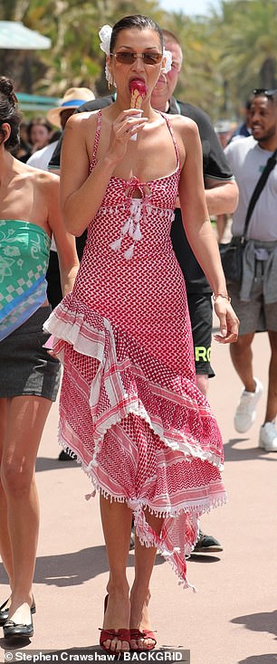 Bella stood out from the crowd as she strolled along the Croisette, where she was flanked by a security guard.