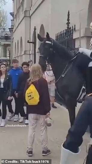 The incident, which went viral on TikTok, shows the blonde woman getting in the guard's way at Horse Guards Parade.