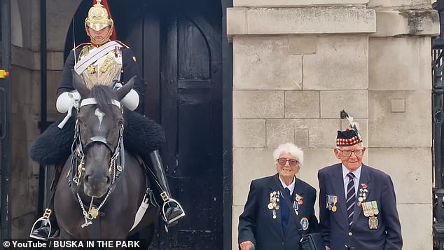 An elderly military veteran was treated to the friendlier side of a member of the King's Guard when the soldier approached her and allowed the woman to pet his horse's nose.