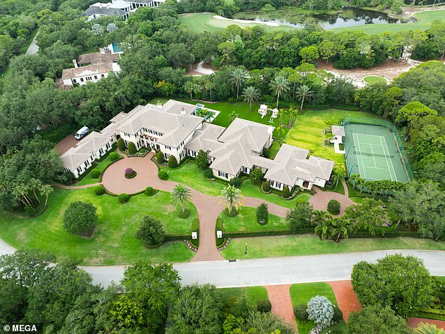 The aerial view of the home shows the entire driveway, as well as the family's tennis court and surrounding golf courses.