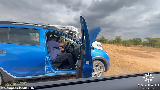 Richard used his car to block the lions while another motorist started the stranded vehicle.