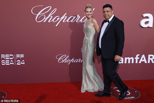 The former sporting legend put on a stylish display as he joined his stunning wife, 33, for the annual charity event.