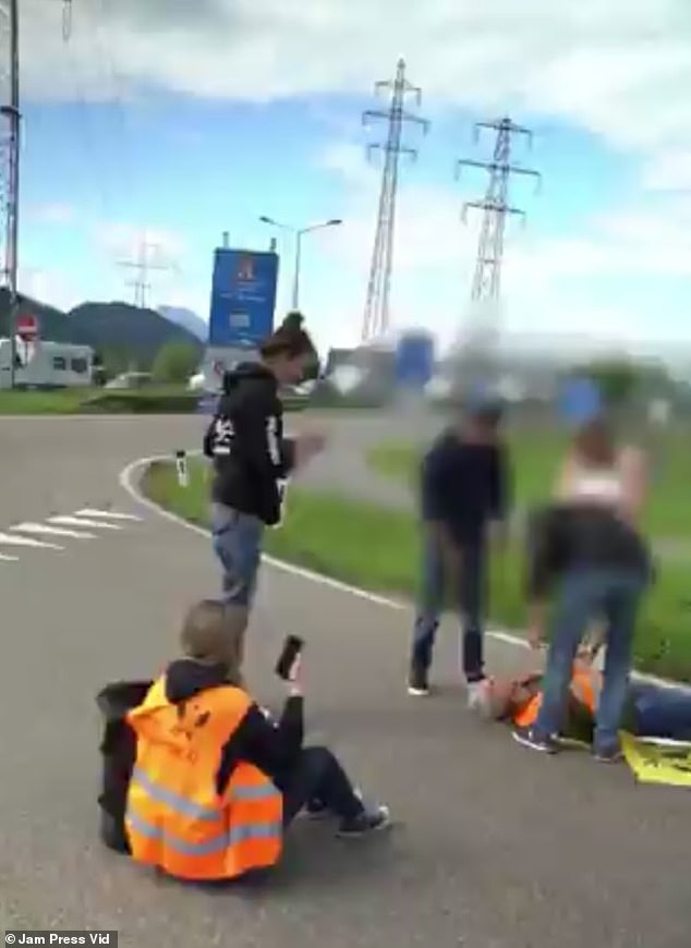 Members of Extinction Rebellion and Last Generation stuck to a roundabout in Hohenems, near the Swiss border.