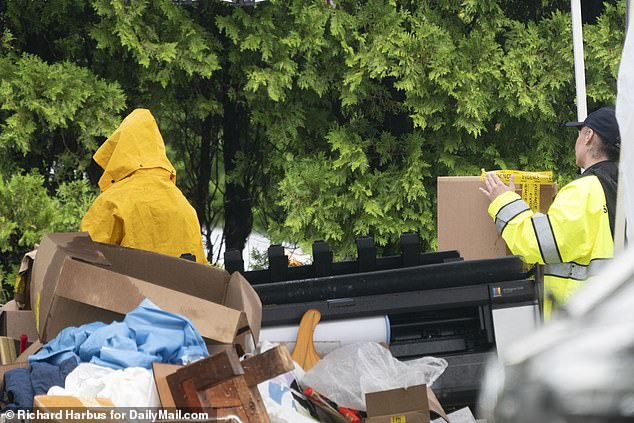 During Thursday's search, crews wearing gloves and face masks were seen standing on folding chairs picking up paint chips from under the porch rafters.