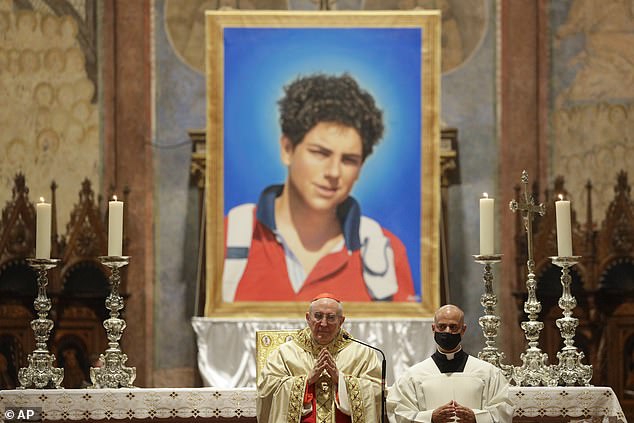 Cardinal Agostino Vallini, center, in the Basilica of Saint Francis in Assisi, Italy, during Carlo's beatification ceremony, one of the steps toward sainthood.